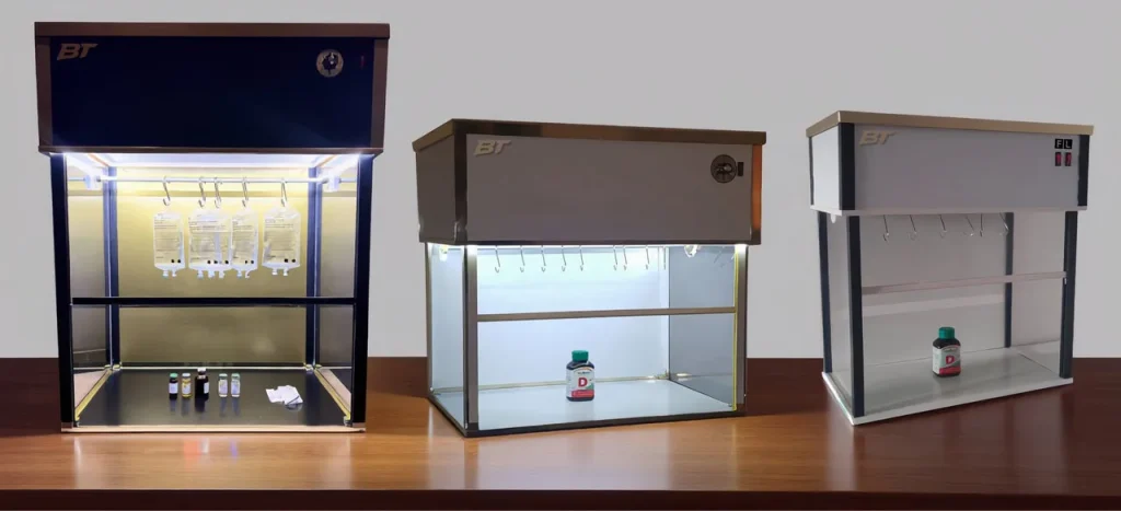 Three benchtop laminar flow hoods showing size difference